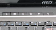 A few hot keys are found above the keyboard. Their functions from left to right: DVD eject, screen power, power settings, Mobility Center, Wi-Fi, power